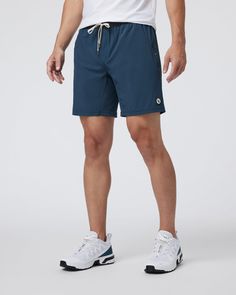 One short for every sport, the Kore Shorts have a classic athletic fit, falling just above the knee with an anywhere and everywhere versatility. Go commando in confidence with the breathable, boxer-brief liner.Also available in 5" and 9" inseam. | Vuori Kore Shorts | Indigo | XXL Vuori makes premium performance apparel inspired by the active Coastal California lifestyle; an integration of fitness, surf, sport, and art. Breaking down the boundaries of traditional activewear, we are a new perspect Outdoor Compression Moisture-wicking Shorts, Outdoor Compression Shorts With Moisture-wicking, Outdoor Moisture-wicking Compression Shorts, Recycled Polyester Athletic Shorts With Elastic Waistband For Sports, Sportswear Athletic Shorts With Functional Drawstring For Outdoor, Go-dry Sportswear Shorts For Outdoor, Outdoor Athletic Shorts With Functional Drawstring, Navy Activewear With Built-in Shorts For Gym, Functional Nylon Swim Trunks For Training