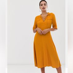 Never Worn. Color Is A Burnt Orangey/Gold Color. Orange V-neck Midi Dress For Work, Orange Midi Dress For Summer Workwear, Summer Workwear Orange Midi Dress, Summer Orange Midi Dress For Workwear, Orange Midi Length Dress For Work, Orange Knee-length Midi Dress For Brunch, Orange Knee-length Dress For Work, Orange Knee-length Midi Dress For Day Out, Vestidos Retro