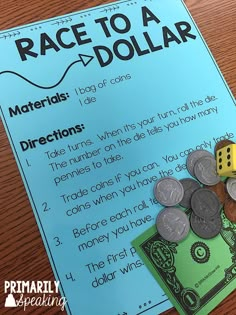 a race to a dollar game with coins and dice on the table next to it