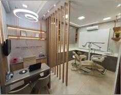 an office with dental equipment in it and lights on the wall above desks,