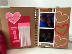 an open book with pictures and hearts on the pages, inside which are cut out photos