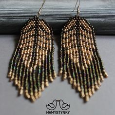 These gold leaf earrings are made of high-quality Czech beads and metal components. They are elegant, fashionable, and highly versatile, suitable for everyday wear. Features: Sterling silver hooks Color: gold, light pink. This item is currently in stock. You must be completely satisfied. If you find merchandise unsatisfactory for any reason, return it within 10 days and your money will be refunded without questions. These earrings in white color https://www.etsy.com/listing/625688944/leaf-white- Gold Chandelier Earrings With Colorful Beads For Party, Gold Chandelier Earrings With Colorful Beads, Elegant Gold Earrings With Colorful Beads, Native Indian Jewelry, Gold Long Earrings, Seed Bead Earring, Fringe Earring, Boho Earring, Bead Earring