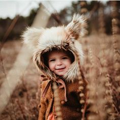 Golden Fox Bonnet is perfect to keep your toddlers head warm through the colder months and also super fun for pretend play! The ears add to the cuteness of this hat.  The outer fabric sewn from luxury golden faux fur & the inner lining is a soft flannel. This bonnet has ties to help secure the hat & prevent your child from pulling it off. Designed to emulate the perfect color and softness of genuine fur.  Size XXS approx 15" Size XS  approx  16"-18"  head circumference 6 months - 12 months  Size Baby Fur, Fluffy Hat, Wolf Hat, Fox Kids, Fox Hat, Warm Winter Hats, Baby Bonnet, Fur Hat, Wild Things