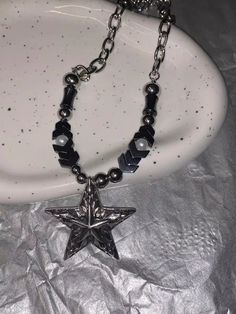 𝔇��𝔢𝔱𝔞𝔦𝔩𝔰: Style: Punk, Goth, Alternative, Darkwear, Material: Alloy Metal The wearer of this punk necklace is taking a stand for meteorite fashion. The star pendant beads embrace trends while remaining timeless, crafted from durable metal with a cool, cratered texture inspired by the cosmos. Solid material, high-quality necklace Enjoy free shipping with a purchase of over 80$ Edgy Silver Beaded Jewelry, Silver Star-shaped Alloy Jewelry, Black Alloy Punk Necklace, Silver Beaded Punk Jewelry, Edgy Silver Star-shaped Jewelry, Edgy Silver Alloy Jewelry, Silver Star-shaped Metal Necklace, Edgy Silver Alloy Necklace, Silver Punk Pendant Necklace