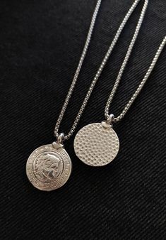 This necklace is composed of an ancient greek spinner coin pendant in silver filled brass, a  durable and fashionable piece that compliments any outfit. Perfect gift for him! The pendant is also double sided as seen in the picture. About the coin:Alexander the Great, was a king of the ancient Greek kingdom of Macedon. He succeeded his father Philip II to the throne in 336 BC at the age of 20 and spent most of his ruling years conducting a lengthy military campaign throughout Western Asia, Central Asia, parts of South Asia, and Egypt. By the age of 30, he had created one of the largest empires in history, stretching from Greece to northwestern India. He was undefeated in battle and is widely considered to be one of history's greatest and most successful military commanders. Available in 4 c Silver Tarnish Resistant Coin Medallion Necklace, Silver Tarnish-resistant Coin Medallion Necklace, Silver Minimalist Medallion Coin Necklace, Minimalist Silver Coin Medallion Necklace, Silver Minimalist Coin Necklace, Tarnish Resistant, Silver Medallion Necklace With Tarnish Resistant Round Pendant, Silver Tarnish Resistant Medallion Necklace With Round Pendant, Silver Tarnish Resistant Round Disc Coin Necklace, Silver Tarnish Resistant Coin Necklace