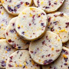 cranberry orange shortbread cookies are piled on top of each other