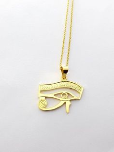 Eye of Horus Gold Necklace, 14k Gold Vermeil Over Sterling Silver Eye Necklace, Egyptian Jewelry.Eye of Horus, in ancient Egypt, a symbol representing protection, health, and restoration.According to Egyptian myth, Horus lost his left eye in a struggle with Seth. The eye was magically restored by Hathor, and this restoration came to symbolize the process of making whole and healing. For this reason, the symbol was often used in amulets.• Material: Eye Of Horus necklace is handcrafted using premi Ancient Style Engraved Yellow Gold Necklaces, Gold Ancient Style Engraved Necklace, Ancient Style Gold Engraved Necklace, Ancient Style Engraved Gold Necklace, Symbolic 14k Stamped Pendant Necklace, Symbolic 14k Stamped Pendant Jewelry, Ancient Gold Pendant Jewelry, Ancient Style Gold Pendant Jewelry, Symbolic 14k Gold Necklaces