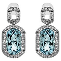 Presented an antique Aquamarine Drop Earring that is accented with White Diamond all around and enhances the beauty of the Earring. This Earring accented with Diamonds is made in White Gold, which looks very Elegant. Aquamarine Drop Earring in 18Karat White Gold with White Diamond. Aquamarine: 16.369 carat, 16.3X9.8mm size, Cushion shape. White Diamond: 1.705 carat, 2.10mm size, Princess shape, G color, VS clarity. White Diamond: 0.084 carat, 1.80mm size, round shape, G color, VS clarity. White Luxury Wedding White Topaz Diamond Earrings, Luxury Platinum Diamond Earrings Hallmarked, Luxury Diamond Earrings With Halo Design, White Gold Platinum Gemstone Earrings, Luxury Pave Set Earrings For Formal Occasions, Luxury Pave Setting Earrings For Formal Events, Platinum White Gold Earrings With Gemstone, Luxury Hallmarked Oval Diamond Earrings, Luxury Platinum Blue Earrings