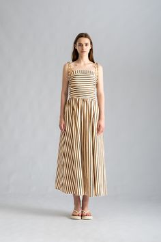 Embrace the effortless elegance of our Katherine Striped Black Maxi Dress. With its smocked back and adjustable shoulder ties, this European-designed dress offers a comfortable and customizable fit. The minimalistic design and breezy feel make it the perfect choice for a stylish and carefree date night look. ᴄᴏᴍᴘᴏꜱɪᴛɪᴏɴ65% polyester and 35% cotton ꜱɪᴢᴇ ᴀɴᴅ ꜰɪᴛFit Type: FittedFabric Stretch: No Stretch Vacation Midi Dress With Smocked Back And Straight Neckline, Midi Dress With Smocked Back For Day Out, Beach Midi Dress With Tie Back And Straight Neckline, Beach Maxi Dress With Tie Back And Straight Neckline, Chic Summer Smocked Dress With Elastic Shoulders, Chic Smocked Dress With Adjustable Straps For Beach, Chic Summer Midi Dress With Elastic Shoulders, Brunch Sundress With Smocked Back And Straight Neckline, Chic Maxi Dress With Smocked Back And Straight Neckline