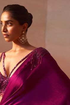 Purple pre-draped asymmetric satin saree with tonal sequin embellishments on the waistband and shoulder. Paired with a strappy bustier with sequin, cutdana and bead embroidery. - Aza Fashions Festive Embellished Pre-draped Saree, Embellished Pre-draped Saree For Wedding, Elegant Embellished Saree For Celebration, Elegant Floor-length Pre-draped Saree For Celebration, Drape Saree, Purple Beads, Satin Saree, Purple Satin, Sweetheart Neck