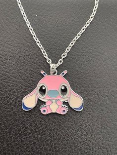 CUTE STITCH NECKLACE (From Lilo & Stitch) With Enamel Charm 16 or 18 inch Silver Plated Chain In  Organza Gift bag Pink Enamel Charm Necklace, Pink Enamel Charms Necklace, Pink Enamel Necklaces With Charms, Personalized Pink Enamel Necklace, Pink Enamel Charm Necklace As Gift, Cute Enamel Necklaces For Gifts, Themed Necklace With Lobster Clasp As Gift, Cute Charm Necklaces With Adjustable Chain For Gift, Nickel-free Enamel Pendant Charm Necklace