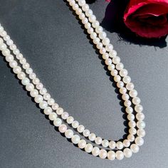 Featuring a timeless classic 2 line pearl string necklace. Must have for every women, this aesthetic piece pairs well with Indian as well as Western outfits. Crafted with love, this 2 line pearl string necklace will complete any look while adding a touch of elegance and sophistication. An essential addition to any wardrobe. Length 42 CM Weight of pearls - 62.60 GMs Formal Double Strand Pearl Necklace With Pendant, Luxury Double Strand Pearl Necklace, Double Strand Pearl Necklace For Formal Occasions, Formal Double Strand Pearl Necklace, Classic Double Strand Pearl Pendant Necklace, Double Strand Akoya Pearl Necklace, Classic Double Strand Necklace With Pearl Pendant, Classic Double Strand Pearl Necklace With Pendant, Classic Double Strand Pearl White Necklace