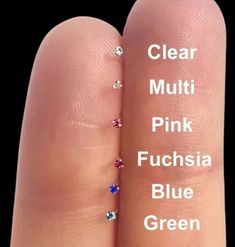 two fingers that have different colored stones on each finger and the words clear, mulit, pink, fuchsia, blue, green