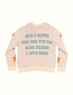 Miami Dolphins x Duvin "A Flippin Good Time" Limited Collection *Knit is exclusive to Duvindesign.com and Dolphins Stadium This knitted vintage Miami Dolphins crewneck takes you back to the era of legends. Crafted from a cozy knit blend, it's got that perfectly worn-in feel, like it’s been passed down from generations of die-hard fans. Knitted with high-quality materials. Relaxed, comfortable fit and perfect layering option with the rest of the Duvin x Dolphins collection. Mid-weight vintage kni White Retro Sweater With Letter Print, Retro White Sweater With Letter Print, Streetwear Crew Neck Knit Sweater, Cozy Crew Neck Sweater With Graphic Print, Relaxed Fit Knit Sweater With Graphic Print, Knit Sweater With Graphic Print In Relaxed Fit, Retro Crew Neck Knit Top, Retro White Crew Neck Sweater, Vintage Letter Print Winter Sweater