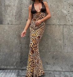 This summer, elevate your wardrobe with this stunning Lace Leopard Print Maxi Dress. Made with high-quality polyester fabric, this dress has a slight stretch for comfortable wear. The regular fit and straight silhouette flatter your figure, while the deep V-neckline and backless design add a touch of sensuality. The delicate lace detailing and ankle-length hemline bring a touch of elegance to this sexy and chic dress. Perfect for any occasion, this dress will surely turn heads and leave a lasting impression. Don't miss out on adding this dress to your collection - order now before it's gone! Fitted Maxi Slip Dress For Date Night, Stretch V-neck Slip Dress For Date Night, Fitted V-neck Backless Dress For Beach, Fitted V-neck Backless Beach Dress, Fitted Halter Neck Lined Maxi Dress, Spring V-neck Backless Dress, Fitted V-neck Dress For Date Night, Summer Bodycon Lined Dress, Summer Bodycon Dress With Lining