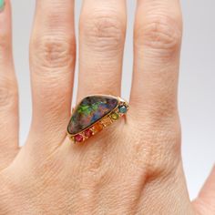 "A mini version of the rainbow opal peacock ring! Super colorful 6.1ct Austrailian boulder opal set in 14k yellow gold with a rainbow of tourmalines. Ring face measures 1/2\" x 7/8\". Ring size 6. Weighs 5.75 grams. Sizing available Layaway available" Peacock Ring, Boulder Opal Ring, Watch Cufflinks, Rainbow Opal, Bow Ring, Dream Ring, Opal Ring, Boulder Opal, Opal Rings