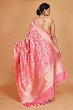 Look your ethnic best on special occasions in this light pink Katan silk Banarasi saree. It is adorned with an overall zari work jaal. The saree comes with a matching blouse piece. Disclaimer: The shown stitched blouse on the model is for display purpose only. The saree comes with a matching blouse piece and finished with fall and piko. Pink Dola Silk Blouse Piece For Transitional Season, Pink Bollywood Pre-draped Saree With Meenakari, Transitional Pink Dola Silk Blouse Piece, Transitional Pink Saree With Zari Work, Pink Banarasi Silk Pre-draped Saree, Transitional Pink Banarasi Silk Pre-draped Saree, Transitional Season Pink Banarasi Silk Pre-draped Saree, Pink Meenakari Traditional Wear For Eid, Pink Traditional Wear With Meenakari For Eid