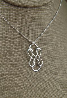 Triple infinity necklace in sterling silver, sterling silver necklace, infinity, eternity necklace, friendship, mother's day A sterling silver triple infinity symbol link that measures 1.18 x 0.59 inches (30 x 15mm) is suspended from a sterling silver chain with 3 jump rings and the chain can be any length up to 22 inches. It is secured with a sterling silver spring ring clasp. Your purchase will arrive in a jewelry box ready for gift giving or as a gift for yourself! Enter my shop here: jersey6 Cheap Infinity Shaped Jewelry Gift, Modern Twist Sterling Silver Necklace In Silver, Modern Twist Silver Sterling Silver Necklace, Modern Twist Sterling Silver Necklace, Modern Silver Pendant Jewelry, Sterling Silver Necklace For Anniversary, Silver Cable Chain Jewelry For Wedding, Silver Cable Chain Wedding Jewelry, Sterling Silver Jewelry With Adjustable Chain For Anniversary