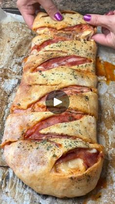 the bread is covered with bacon and cheese