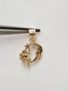 "Thanks for shopping our vintage estate store. We tend to sell well below wholesale and truly hope you enjoy all of our items. Many of the items are one of a kind, so please enjoy scrolling through the pictures and hopefully something will catch your eye. Brown spots are from reflections or camera. Estate 14k yellow gold angel moon star pendant. Retails $269 on sale $139 Length: 7/8\" with bail Width: 5/8\" Weight: 1.06 grams Bail: 2mm Nice pendant, makes a nice gift. Marked 14k." Collectible Round Pendant With Moon Charm, Antique Yellow Gold Star Jewelry, Antique Gold Moon Jewelry, Gold Crescent Jewelry With Charms, Gold Celestial Jewelry For Collectors, Yellow Gold Crescent Jewelry With Star Charm, Antique Gold Star-shaped Jewelry, Vintage Gold Moon-shaped Jewelry, Crescent Shaped Yellow Gold Jewelry With Star Charm