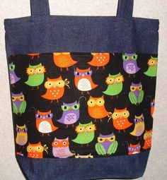 an owl print tote bag is hanging on the wall with it's zippered closure