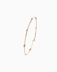 The Dainty Diamond & Petroglyph Hook Bracelet, handcrafted in gently hammered 14K solid gold, showcases tiny replicas of the iconic St. John petroglyph and faceted diamonds along the band. Secured with a dainty hook clasp, this bracelet seamlessly blends versatility and style, making it the perfect choice to wear solo or stacked with other favorites. Metal: 14K solid gold Stones: Diamond Band Width: 1.5mm Stone Size: 2mm Style #: GB119D Hook Bracelet, Hook Clasp, Diamond Band, Diamond Bands, St John, Solid Gold, Diamonds, Bracelet, Band