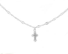 This dainty cross on a shimmering sequin chain necklace is versatile and stylish, adding a touch of elegance and sparkle to any outfit. Perfect for both casual and formal wear, the cross pendant is intricately designed to be small and refined, exuding understated beauty and elegance. This necklace is not only a stunning accessory, but also carries profound symbolism. The cross pendant is a timeless symbol of faith, spirituality, and hope, making it a meaningful and cherished adornment for many. Whether worn as a daily reminder of one's beliefs or as a special piece for religious occasions, it serves as a source of comfort, inspiration, and strength.DETAILS:✦ 14k Gold Filled or solid Sterling Silver sequin chain✦ Gold Filled or Sterling Silver hollow back cross charm (10mm) WHY YOU'LL LOVE Cross Pendant Charm Necklace, Elegant Cross Charm Necklace With Adjustable Chain, Minimalist Cross Chain Necklace With Delicate Chain, Clavicle Chain Necklace With Cross Pendant, Minimalist Delicate Chain Cross Necklace, Silver Necklace With Delicate Chain And Cross Pendant, Elegant Cross Necklace With Delicate Chain, Delicate Chain Charm Necklace With Cross Pendant, Silver Cross Necklace With Delicate Chain