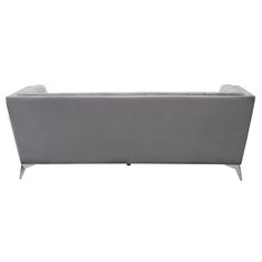 a grey couch sitting on top of a white floor