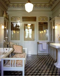 a bathroom with black and white checkered flooring