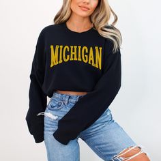 Score major style points with our Michigan Sweatshirt! This spirited design is your ticket to Pure Michigan vibes and college football fervor. Crafted for comfort and Midwestern pride, this sweatshirt lets you wrap yourself in warmth and gridiron spirit - where comfort meets game day excitement! Ideal for any situation, a unisex heavy blend crewneck sweatshirt is pure comfort. These garments are made from polyester and cotton. This combination helps designs come out looking fresh and beautiful. The collar is ribbed knit, so it retains its shape even after washing. There are no itchy side seams on these sweaters.  .: Made with a medium-heavy fabric blend of 50% cotton and 50% polyester (8.0 oz/yd² (271.25 g/m this sweatshirt feels cozy and is the perfect choice for those colder months. .: T State Crewneck, Michigan Sweatshirt, College Game Day, College Games, College Game Days, Pure Michigan, Fan Shirts, Oversized Pullover, Great Lakes