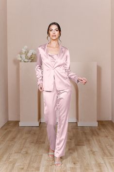 For the bridesmaid that doesn't want a dress, we have you covered! The new Ruby Satin Jacket & Pants set provides a glamorous alternative to a dress and will still have you feeling chic, confident, and comfortable all night long! The Ruby Jacket and Ruby Pants are sold separately. Lindsey size 4, pictured with the Flynn Satin Top in Desert Rose, sold separately. Laken size 24, pictured with the Heidi Chiffon Top in White Pearl, sold separately. FEATURES: Fitted Pants silhouette Side zipper Full- Pink Suit Women, Pink Suits Women, Pants Silhouette, Jacket Silhouette, Bridesmaid Satin, Wedding Parties Colors, Fitted Pants, Satin Jacket, Fitted Jacket