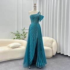 This one-shoulder evening dress radiates luxury and elegance with its sage green color and exquisite design. Perfect for weddings, formal events, and parties, this dress combines style and sophistication. Look and feel like royalty in the beautiful and unique luxury Dubai dress. window.adminAccountId=244214477; Gown With Overskirt, Green Evening Gowns, Green Evening Dress, فستان سهرة, Color Turquoise, Wedding Formal, Mermaid Evening Dresses, Romantic Dinners, Formal Party