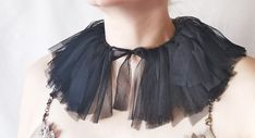 Channeling your inner Black Swan with this fabulous collar tutu! Perfect for festival costumes, stage performances, or adding some drama and flair to any outfit. This tattered neck accessory is your go-to party prop that gets all eyes on you.  ♥ Materials: super soft tulle, friendly on skin, adjustable with ties. You can wear in two ways - see the pictures. One size fits all. Ready to ship! All my designs are one of a kind and completely handmade - a guarantee that you would be exceptional and unique in the whole world. ✂ Sizing ✂ ♥  You can approximate the proportions by viewing the photos or you can use a tape for precise measurements. ♥ Author: This listing is a unique handmade art piece, an original concept-design by Elyseeart label. *ஐ๑ All my products go through stringent quality che Black Ruffled Tutu Dress For Costume Party, Party Ballet Tutu Dress With Ruffles, Elegant Fitted Tutu Dress For Costume Party, Halloween Tulle Tutu Party Dress, Halloween Party Tutu Dress, Halloween Party Tulle Tutu Dress, Spring Party Ballet Tutu Dress, Spring Ballet Tutu Dress For Party, Costume Party Tutu Dress With Attached Cancan