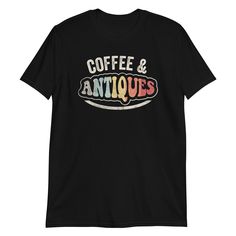 Are you an antique enthusiast with a flair for vintage fashion? The Coffee and Antiques Antique Lover Retro Vintage Style T-Shirt is the perfect addition to your wardrobe! Embrace your unique style and showcase your love for all things retro with this eye-catching tee that adds a touch of nostalgia to your everyday look. This shirt is not just a fashion statement; it offers comfort and quality that stand the test of time. Made from 100% ring-spun cotton, it provides a soft, breathable feel that Retro Short Sleeve T-shirt With Graphic Print, Vintage Graphic Crew Neck T-shirt, Vintage Crew Neck T-shirt With Graphic Design, Vintage T-shirt With Retro Print And Relaxed Fit, Vintage Black Top With Text Print, Vintage Short Sleeve Tops With Text Print, Retro Short Sleeve Tops With Text Print, Vintage Black T-shirt With Relaxed Fit, Black Relaxed Fit Vintage T-shirt