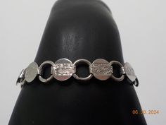 Vintage Sarah Coventry. 7" silver tone "Young and Gay" bracelet. Ten silver tone discs linked together. Standard flip over clasp. Excellent condition. Engraved Metal Bracelet With Oval Links, Formal Hypoallergenic Chain Bracelet, Hypoallergenic Metal Oval Link Bracelet, Nickel-free Round Chain Bracelet For Formal Events, Nickel-free Chain Bracelet For Formal Occasions, Formal Nickel-free Chain Bracelet, Sarah Coventry, Coventry, Chain Link Bracelet