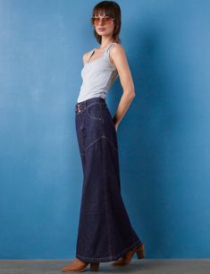 Details of old, made new. Beautiful waist/button detail, with pieced Premium denim construction, the Pieced Denim Maxi Skirt from Wash Lab is a must-own classic. The cover model is 5'9" wearing a size 26 Fabric: 95% Cotton 4% Polyester 1% Spandex Length: 39.25" from waist Cotton Dark Wash Denim Skirt With Belt Loops, Summer Fitted Denim Skirt With Five Pockets, Fitted Five Pocket Denim Skirt For Summer, Fitted Dark Wash Denim Skirt With Five Pockets, Fitted Denim Skirt With Five Pockets For Summer, Dark Wash Denim Skirt With Five Pockets, Fitted Cotton Denim Skirt With Five Pockets, Dark Wash Denim Skirt With Pockets From Recycled Material, Dark Wash Denim Skirt With Pockets In Recycled Denim