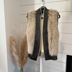 Banana Republic Faux Fur Extra Fine Merino Wool Vest Size Small Xs. Never Worn And In Excellent Condition. Open Front Style, Extra Wide Trim Along The Hem, Shoulders And Neck, Perfect Piece To Layer. Beautiful And Tasteful Fur, Can Dress Up Or Down On A Crisp Fall Or Winter Day. Beige Faux Fur Outerwear For Cold Weather, Chic One-size Winter Outerwear, Cozy One Size Cream Outerwear, Cozy Black Outerwear With Faux Fur Trim, Chic Winter Cardigan With Faux Fur Trim, Chic Winter White Outerwear For Layering, Fitted Cozy Outerwear With Faux Fur Trim, Chic Cream Outerwear For Cold Weather, Chic Cardigan With Faux Fur Trim For Fall