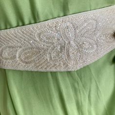 Vintage beaded belt in beige shade. A beautiful accent for a wedding dress, or party outfit. Fits waist 27-28" Elegant Beaded Bridal Belt, Elegant Beaded Fitted Bridal Belt, Elegant Embellished Bridal Belt For Evening, Elegant Embellished Fitted Sash, Elegant Embellished Fitted Sashes, Elegant Fitted Embellished Sashes, Elegant Beaded Adjustable Bridal Belt, Elegant Embellished Sashes, Elegant Embellished Bridal Belt For Party