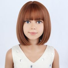 a close up of a doll wearing a white shirt and brown hair with bangs on her head