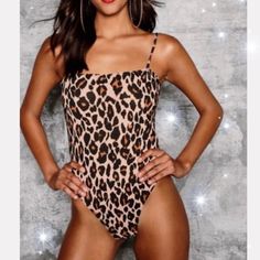 Brand New With Tags Cheetah Print Bodysuit I Ordered The Wrong Size Online :( So I Thought Someone Else Might Love It Just As Much As I Would’ve Materials - 95% Polyester - 5% Elastane Casual Stretch Leopard Print Bodysuit, Summer Party Leopard Print Bodysuit, Leopard Print Sleeveless Swimwear For Party, Fitted Tiger Print Swimwear For Summer, Fitted Leopard Print Bodysuit For Swimming, Leopard Print Bodysuit For Summer Swimming, Summer Leopard Print Swimming Bodysuit, Leopard Print Bodysuit For Swimming In Summer, Trendy Brown Summer Bodysuit