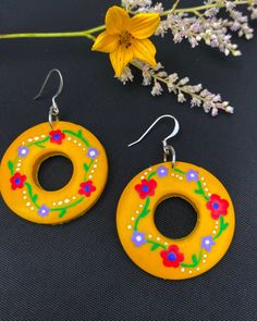 THE 'OMA'. 🌼  These statement yellow earrings are the touch of color that your earring collection needs.  HANDMADE & HAND-PAINTED, these earrings are made with thought and care. Available with gold plated,  silver plated, or sterling silver, for an additional cost.  Limited quantity available.  All earrings in this collection are named after real-life grandmothers, because who knows accessories better than them? 👵 Hand Painted Yellow Artsy Earrings, Hand Painted Earrings For Festivals, Yellow Hand Painted Artsy Earrings, Artistic Hand Painted Yellow Earrings, Unique Hand Painted Yellow Jewelry, Handmade Yellow Circle Earrings, Hand Painted Earrings For Gift And Festivals, Bohemian Yellow Round Earrings, Yellow Bohemian Round Earrings