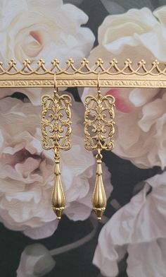 " The Intricate beauty"  Adorn yourself with these lightweight Dangle Earrings with beautiful gold dipped brass metalwork that is made in the United States . Very lightweight.    Truly a work of art like you.  All materials I use are sourced from the USA , Italy , Austrian, The United Kingdom, Spain and Portugal.  Earrings are 2.5" inches long. If you'd like different earwires, please let me know. These ones have 14k gold filled earwires Baroque Filigree, Silver Boho Jewelry, Edwardian Jewelry, Bronze Jewelry, Filigree Earrings, Anniversary Jewelry, Art Deco Earrings, Spain And Portugal, Gold Dipped