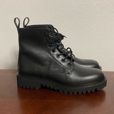 These Are A Brand New Pair Of Valentino Garavani Logo Print Leather Combat Boots In Black Size 45eu/12us Original Box Is Not Included (Comes With Dust Bag) Has Minor Creasing Has Light Scratch Features The Vltn Logo In Black On Both Shoes Leather Upper, Rubber Sole New With Tags Made In Italy Msrp: $1250 Black Leather Lace-up Boots With Vibram Sole, Black Lace-up Boots With Lug Sole And Plain Toe, Black Calf Leather Lace-up Boots, Black Combat Boots With Rubber Sole In Calf Leather, Black Lace-up Boots With Lug Sole, Black Lace-up Boots In Calf Leather, Luxury Black Lace-up Boots With Lug Sole, Formal Lace-up Boots With Lug Sole And Round Toe, Black Combat Boots With Leather Lining