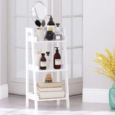 a white shelf with bottles and soaps on it