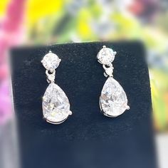 "Length : 0.8\" (2 cm) Main Stone Size: 1.2 cm X 0.8 cm (3 Carat / each) Main Stone Color: Clear White Main Stone Shape: Pear Cut Metal: Real Solid 925 Sterling Silver Hallmark: 925 Plating: Rhodium Plated Stones Setting: Prong Stones: High Quality Lab Moissanite Diamond Finish: High Polished Pear Dangle Drop Earrings 3 Carat Pear Cut Lab Moissanite Diamond 925 Sterling Silver Dangle Drop Wedding Earrings Gift Boxed For Her" Formal Pear-shaped Brilliant Cut Earrings, Teardrop Diamond Earrings With Vvs Clarity For Formal Events, Hallmarked Teardrop Diamond Earrings For Formal Occasions, Formal Bridal Earrings With Brilliant Pear Cut, Pear Shaped Brilliant Cut Bridal Earrings For Formal Occasions, Pear-shaped Brilliant Cut Bridal Earrings For Formal Occasions, Pear-shaped Bridal Earrings With Brilliant Cut For Formal Occasions, Formal Pear-shaped Bridal Earrings With Brilliant Cut, Silver Diamond Bridal Earrings Pear-shaped