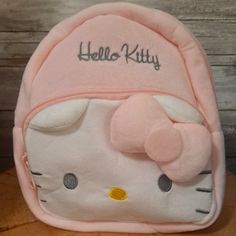 Pastel Pink And Soft Hello Kitty Mini Backpack Zippered Pockets In The Front, Hello Kitty Shaped Pocket With Zipper. Inside- Small Pocket Size: 18cm X 8cm X 23cm Hello Kitty Mini Backpack, Cute Pink Softback Backpack, Pink Kawaii Hello Kitty Backpack, Cute Hello Kitty Backpack For Daily Use, Cute Pink Hello Kitty Backpack, Kawaii Hello Kitty Bag, Cute Hello Kitty Standard Backpack, Cute Pink Backpack With Cat Design, Cute Pink Cat Design Backpack