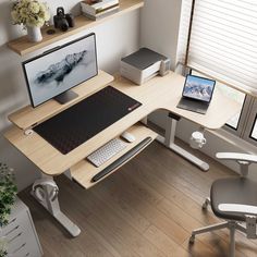 a computer desk with two monitors and a keyboard