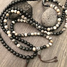 Beautiful black and mix Agate Japa Mala from Nepal. You can choose between the Black Agate mala and the Mix Agate mala necklace. A unique praying mala that can be used as a necklace or as an ornament. The mala has no clasp, you wear it over the head. The mala necklace is 42.5cm- 16.75 inch long A most have addition to your jewelry collect To see more unique Mala necklaces click the link below https://www.etsy.com/shop/AkashiJewelry?ref=seller-platform-mcnav&section_id=18307945 Enjoy Con salu Black Agate Gemstone Beads, Adjustable Agate Hand-strung Mala, Adjustable Hand-strung Agate Mala, Black Polished Beads Necklace For Healing, Agate Beaded Bracelets With 108 Beads For Meditation, Spiritual Agate Mala With Round Beads, Black Agate Round Beads Necklace, Adjustable Agate Mala With Round Beads, Adjustable Black Mala With Round Beads