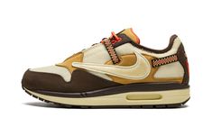 The Travis Scott x Nike Air Max 1 “Baroque Brown” is a limited edition collaboration between the hip-hop superstar and Nike that modifies the iconic retro running shoe with rugged, outdoors-inspired details.  One of two colorways of the Air Max 1 co-designed by Travis Scott and Nike in December 2021, the “Baroque Brown” does away with the tonal look that defines the “Saturn Gold” edition of Scott’s Air Max 1, and instead favors multiple earth tones.  The upper features a Lemon Drop-colored mesh Nike Travis Scott, Hiker Style, Nike X Travis Scott, Retro Running Shoes, Travis Scott Cactus Jack, Jackie Brown, Baskets Nike, Cactus Jack, Nike Dunk High