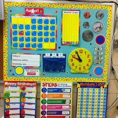 a bulletin board with lots of magnets on it's sides and calendars attached to the back